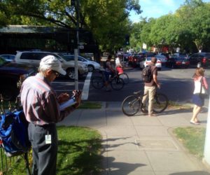 SABA volunteer Mark Tavianini counting bikes at H & 16th streets in downtown Sacramento