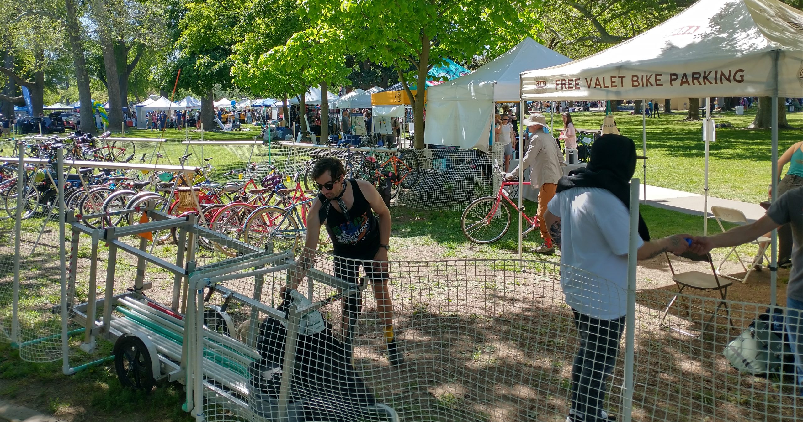 Two people work at a bike valet.