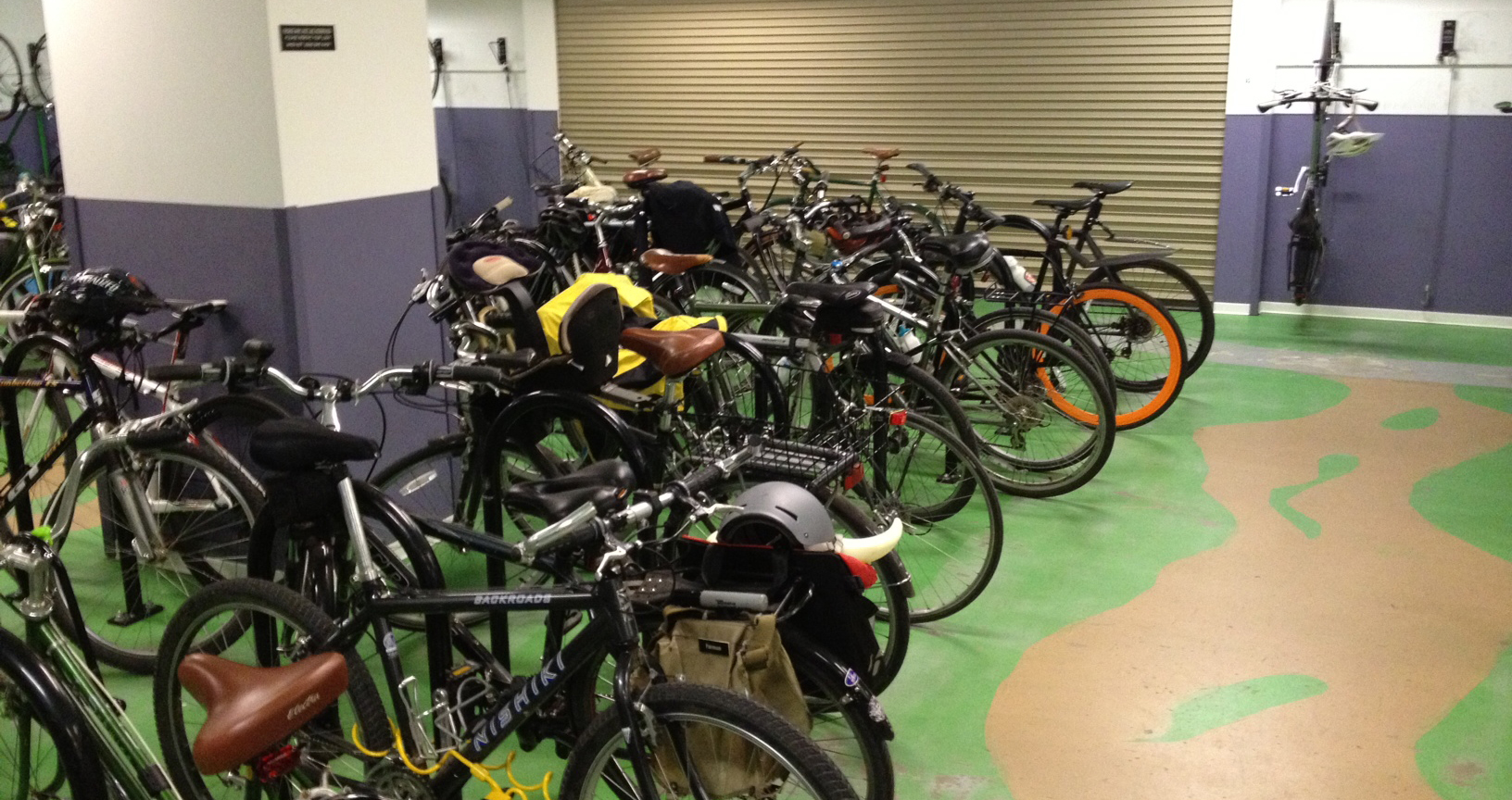 A group of bikes parked inside a building.