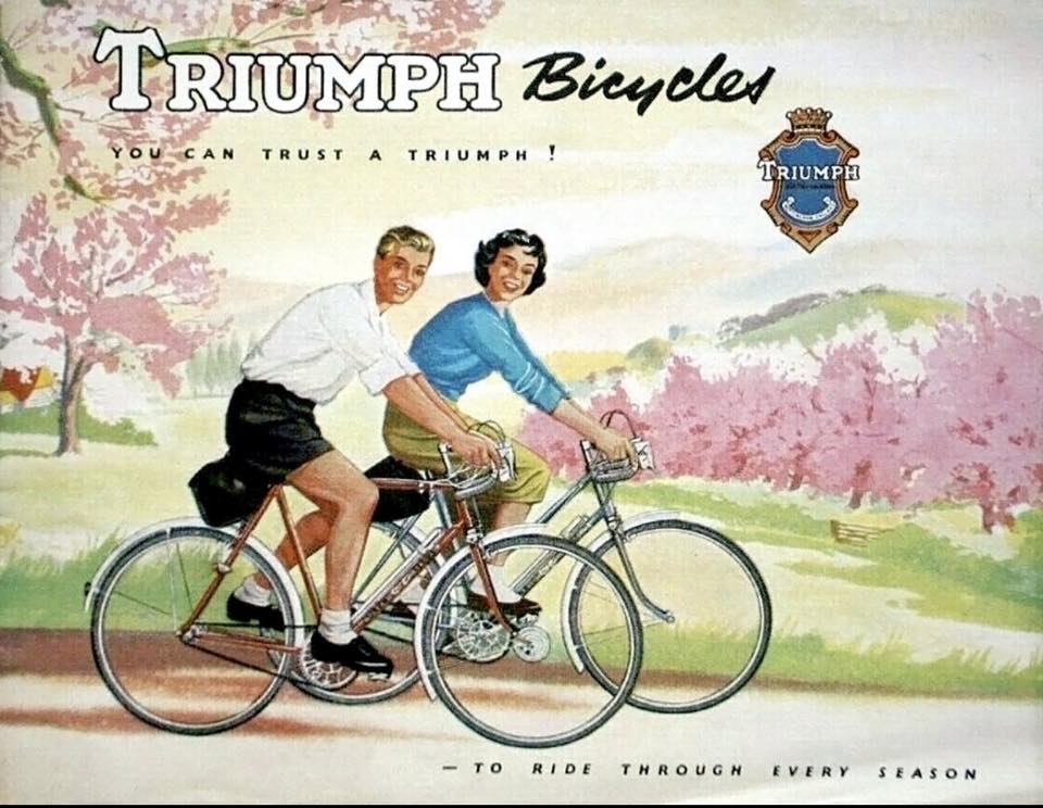 Old ad for Triumph Bicycles - a man and a woman ride bikes on a path.